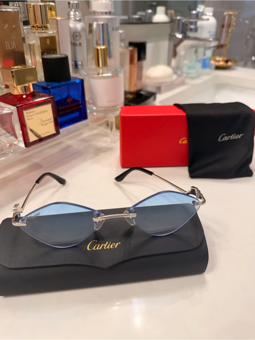 Cartier Women's Rimless Sunglasses with Light Blue Lenses